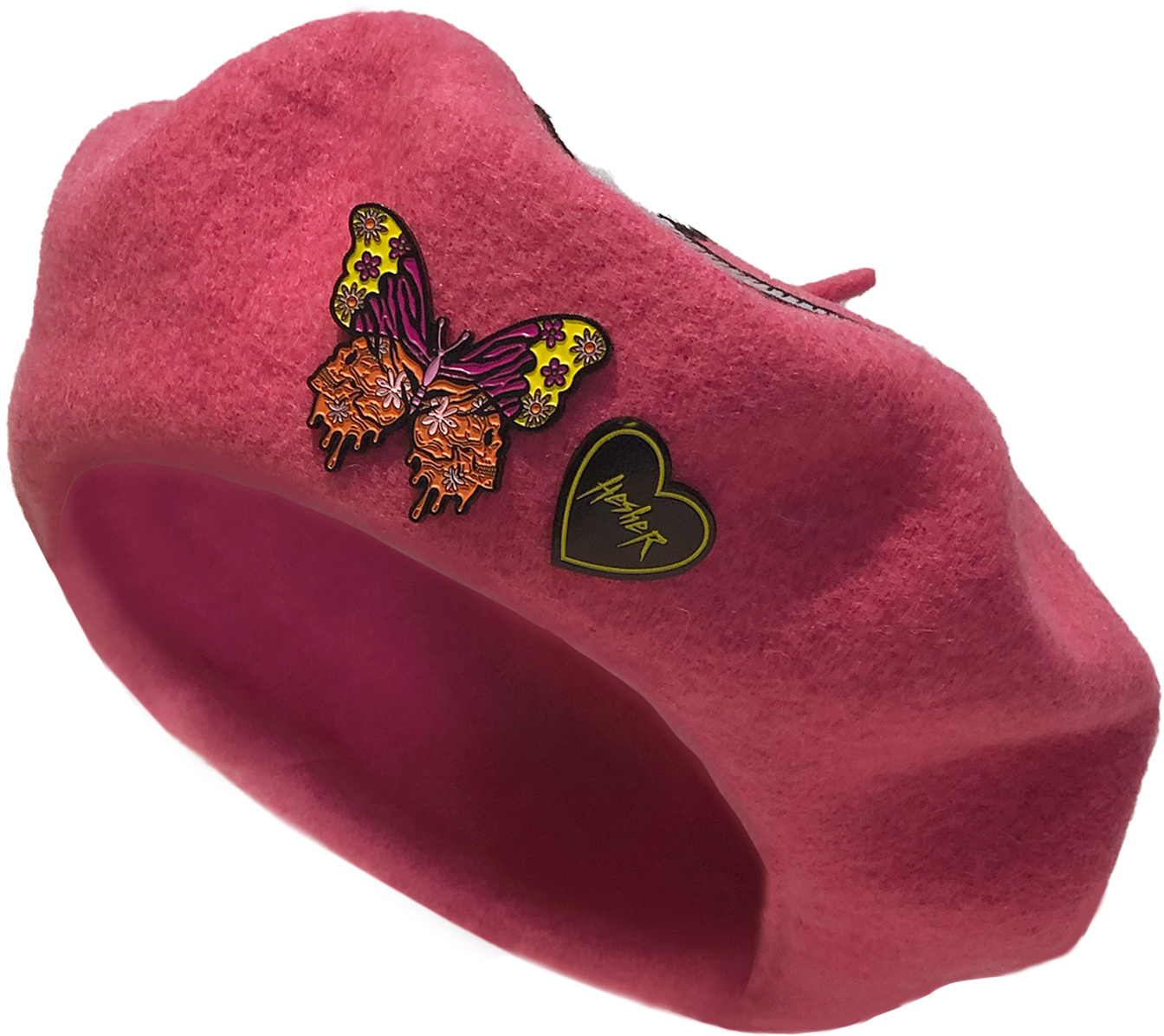 pink wool beret with skull moon heart patch and colorful butterfly metal pin and black and yellow Hesher heart shaped metal pin